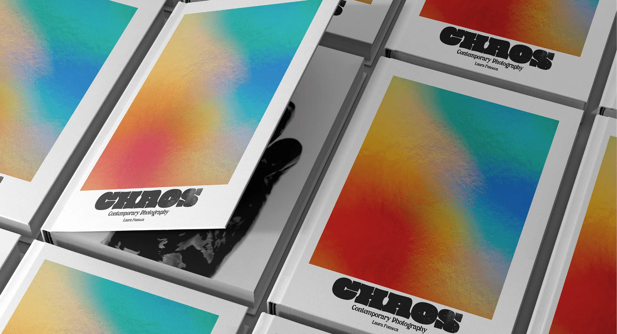 CHAOS photobooks with gradient covers laid out in a grid