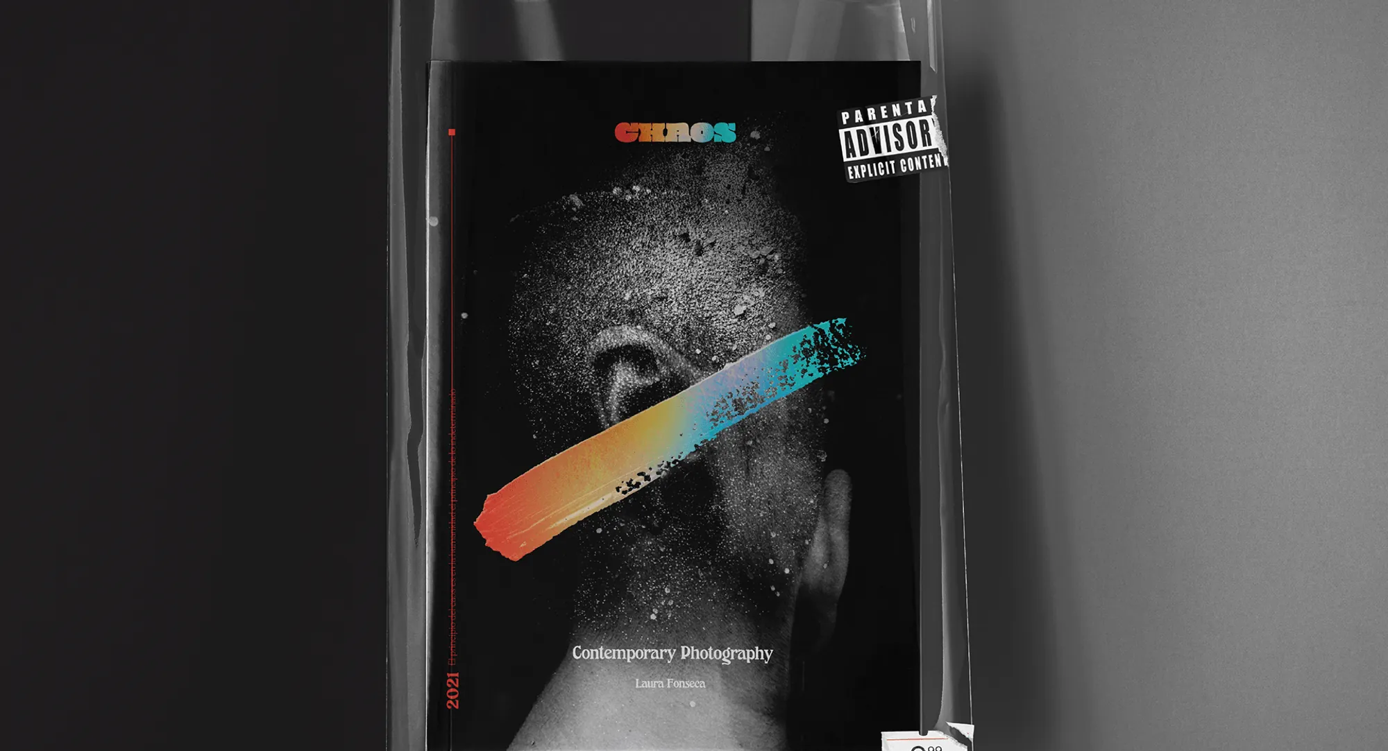 CHAOS cover with a painted stroke across a face