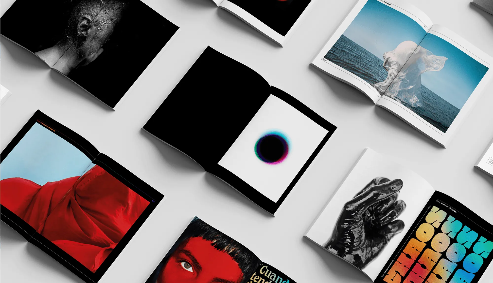 CHAOS books and prints spread out on a table