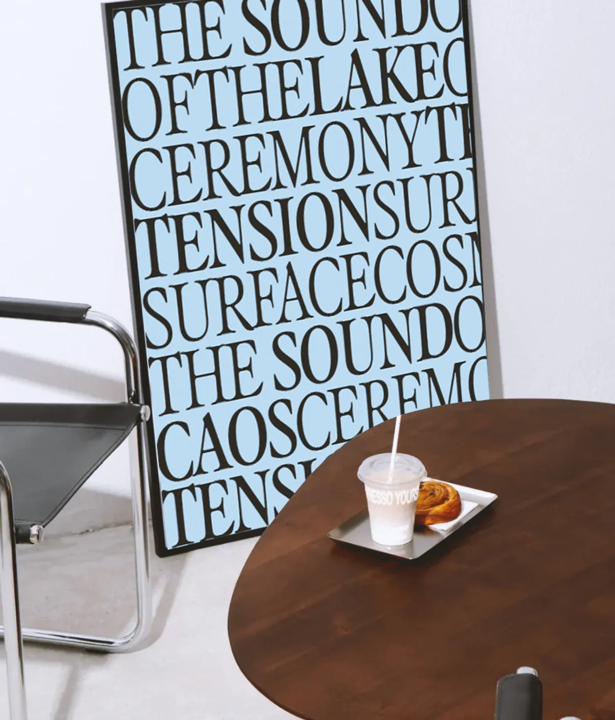 Typographic poster in blue on a café table