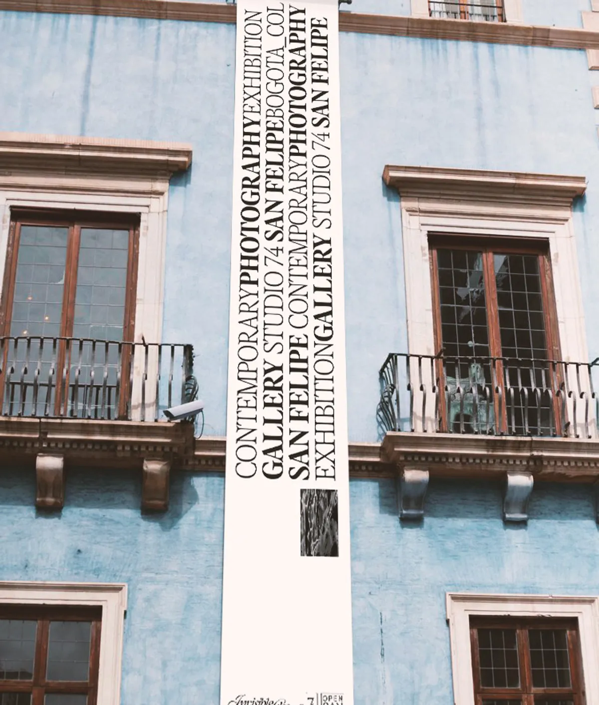 Vertical banner on a colonial building facade