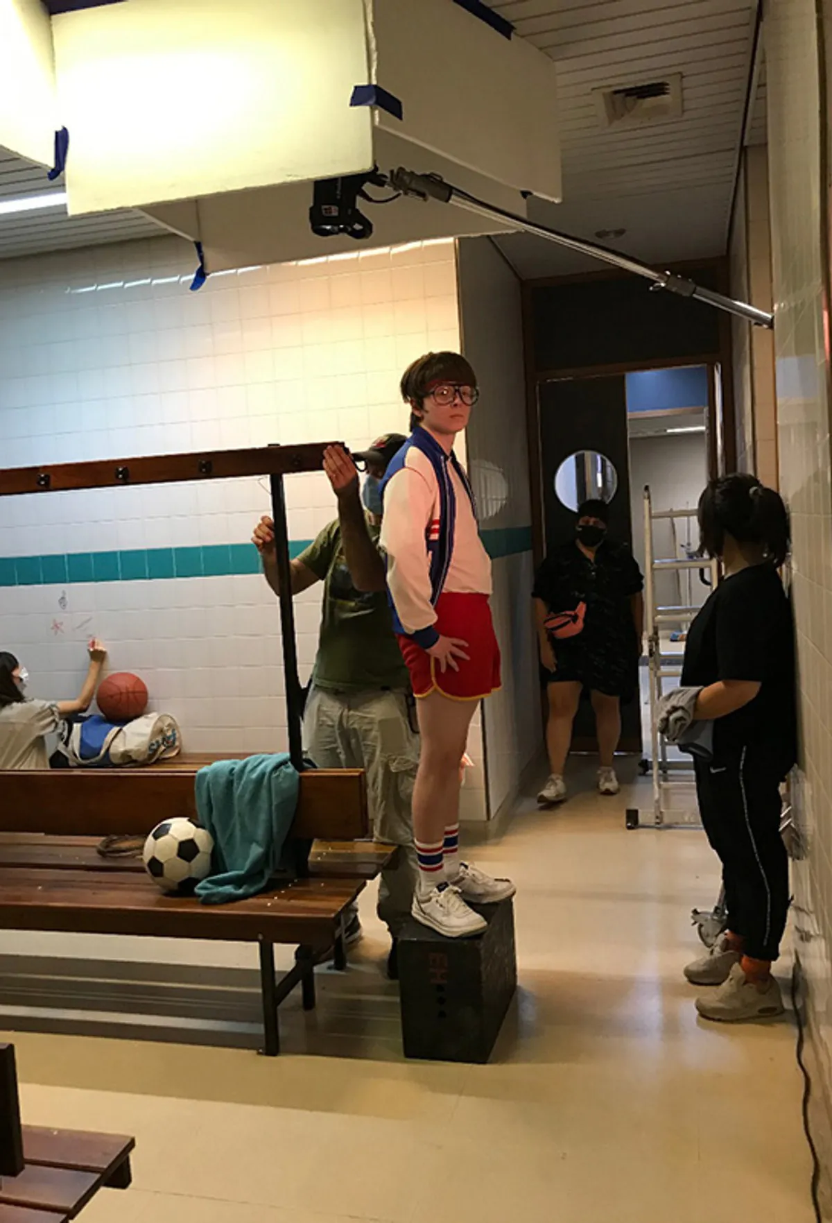 Behind the scenes: the crew setting up in a school corridor