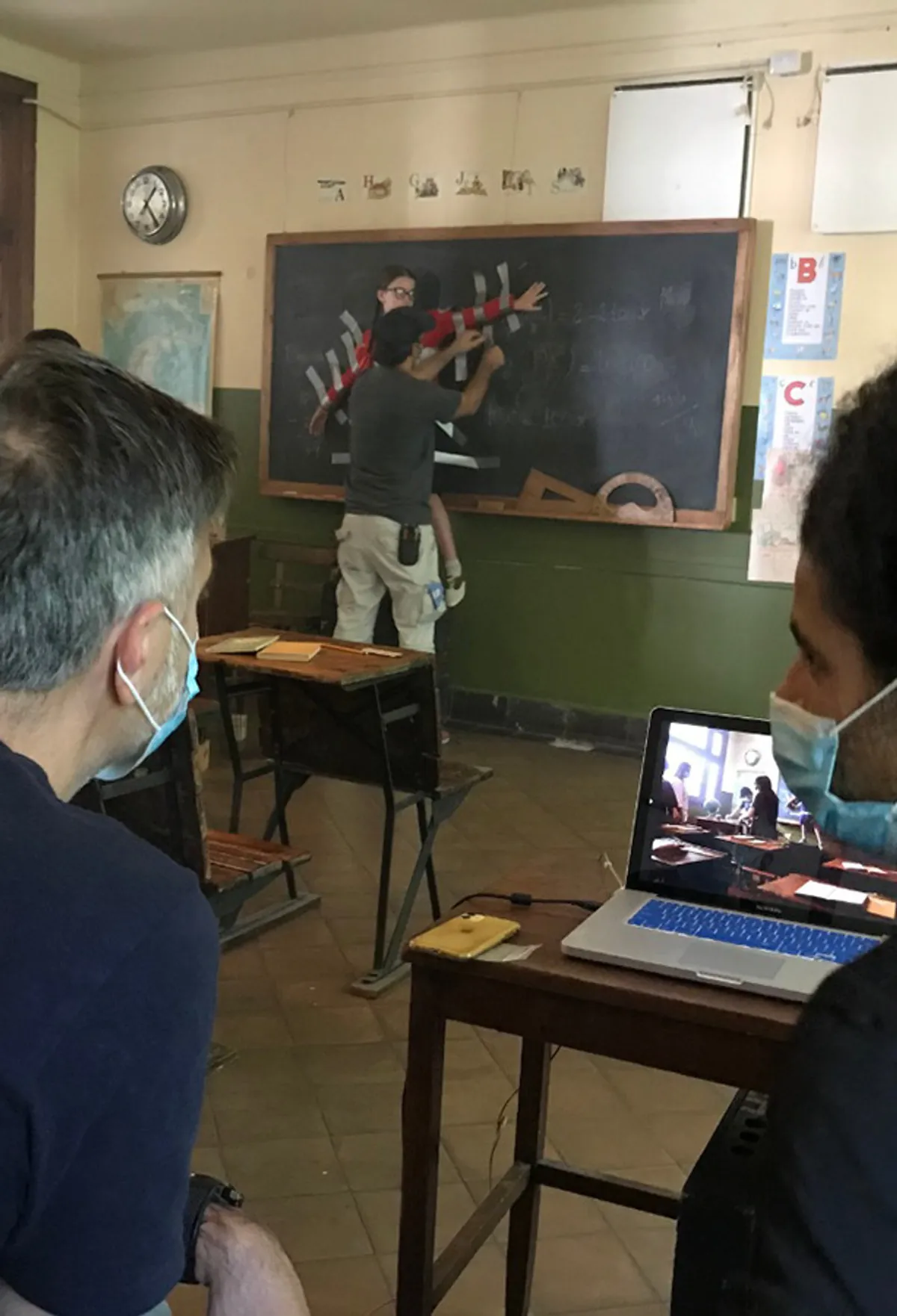 Behind the scenes: reviewing shots on a laptop